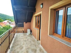 a balcony of a house with a window at Apartman 2 RIBIČ in Ogulin