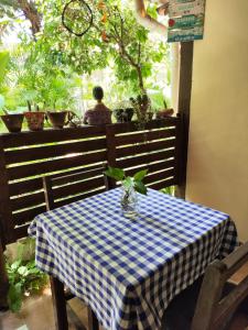 a table with a blue and white checkered table cloth at Vila do Sossego in Jericoacoara