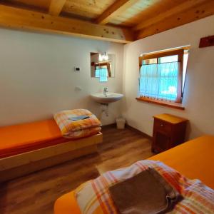 Postel nebo postele na pokoji v ubytování Rifugio Stella Alpina Spiz Piaz per escursionisti