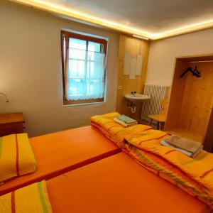 Postel nebo postele na pokoji v ubytování Rifugio Stella Alpina Spiz Piaz per escursionisti