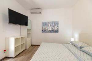 Postel nebo postele na pokoji v ubytování Mazzeo beach house 2