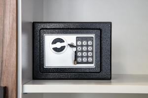 a remote control sitting on top of a shelf at BG Palace Hotel in Tbilisi City