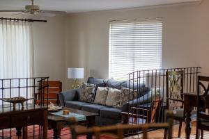 a living room with a couch and a table at Boungainvillea 1203 Luxury Apartment - Reserva Conchal in Playa Conchal