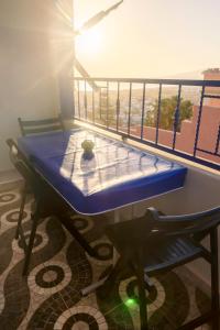 a ping pong table on a balcony with a view at The Rina Hostel in Agadir