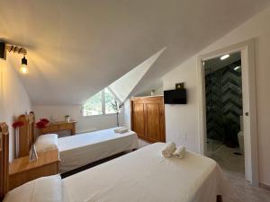Postel nebo postele na pokoji v ubytování Hostal Sango Sierra de las Nieves
