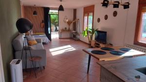 a living room with a couch and a table at Ca Sunyer in Batea