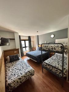 Postel nebo postele na pokoji v ubytování Hotel Merino