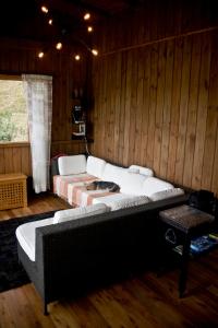 a room with a couch and a bed in it at Colina Branca in Rio Rufino