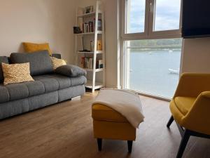 a living room with a couch and a window at Apartment Nelli in Medulin