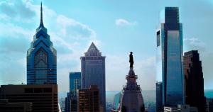 a city skyline with a statue of a man at Loews Philadelphia Hotel in Philadelphia