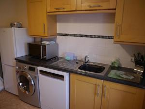 Η κουζίνα ή μικρή κουζίνα στο Laghead Steading Cottage +14 φωτογραφίες
