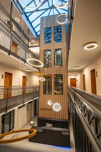 a lobby of a building with a ceiling at Boardinghouse CityHome am Kurpark in Bad Salzuflen