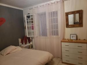 Postel nebo postele na pokoji v ubytování Miss G'Ainguette