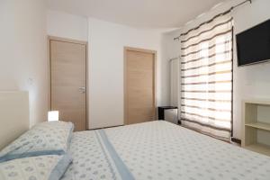 Postel nebo postele na pokoji v ubytování Mazzeo beach house 2