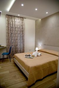 Postel nebo postele na pokoji v ubytování Fiore dei Templi - luxury suite experience