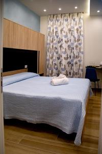Postel nebo postele na pokoji v ubytování Fiore dei Templi - luxury suite experience