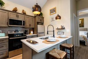 a kitchen with a sink and a counter top at Downtown Tiny Life - Experience Tiny Living! in Orlando