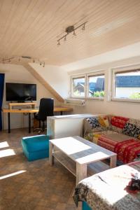 a living room with a couch and a table at Apartment Pirnat in Bohinj