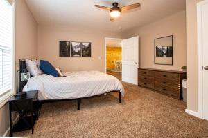 a bedroom with a bed and a ceiling fan at Cedar Hill Heart of Hocking Hills in Rockbridge