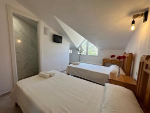 Postel nebo postele na pokoji v ubytování Hostal Sango Sierra de las Nieves