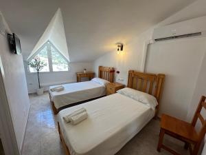 Postel nebo postele na pokoji v ubytování Hostal Sango Sierra de las Nieves