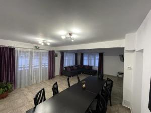 a living room with a table and a couch at Casa EVA in Panaci