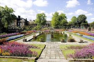 a garden with a pond and flowers at Stunning 1 Bed flat in Canary Wharf FREE parking in London