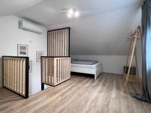 A bed or beds in a room at Best Apartman Lelle