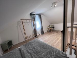 A bed or beds in a room at Best Apartman Lelle