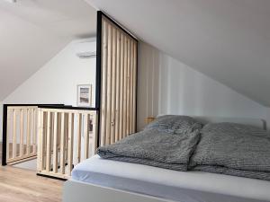 A bed or beds in a room at Best Apartman Lelle