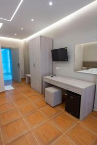 TV a/nebo společenská místnost v ubytování Hotel Miami Beach