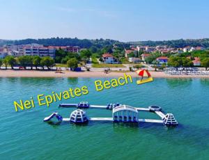 a roller coaster in the water near a beach at Partcon Studio in Private Property A in Neoi Epivates