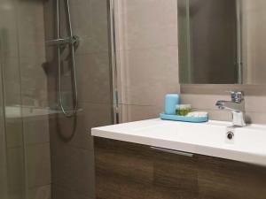 a bathroom with a sink and a shower with a mirror at ANMAN HHBB tourism & business rooms in Padova +13 photos