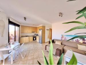 a living room with a couch and a table at Sunny Home La Tejita in Granadilla de Abona