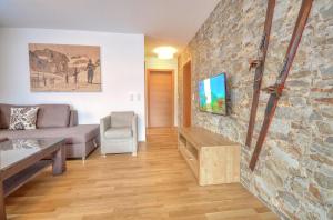 Telewizja i/lub zestaw kina domowego w obiekcie Alpin & Seeresort Top 10 - by Alpen Apartments
