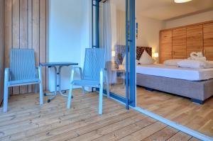 Łóżko lub łóżka w pokoju w obiekcie Alpin & Seeresort Top 10 - by Alpen Apartments