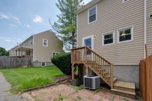 a home with a wooden staircase next to a house at Blacksburg Vacation Rental Near Virginia Tech! in Blacksburg