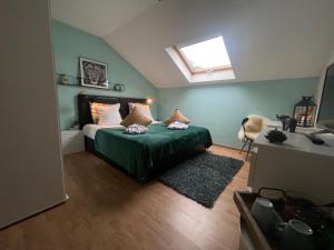 a bedroom with a bed and a skylight at Dreamland Resort in Zaventem