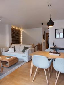 Ένα ή περισσότερα κρεβάτια σε δωμάτιο στο Acogedor dúplex en el Valle de Aran