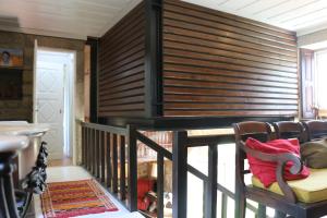 a room with a staircase with wooden blinds at CASA DO ARCO - BARCELOS in Barcelos