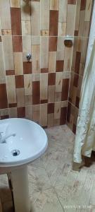 a bathroom with a white sink and a shower at EL DORADO POUSADA in Barcelos +108 photos
