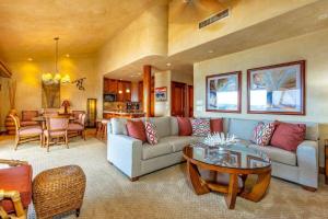 a living room with a couch and a table at MAKENA SURF #B304 condo in Wailea