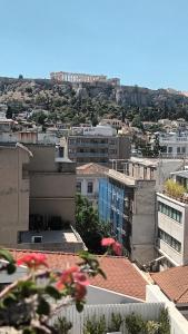 a view of a city with buildings at Sandra"s Stay Penthouses with Acropolis View in Athens