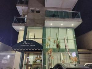 a building with a store front with a sign on it at Flats da Júnia - ótimo beneficio com wifi, ar, tv, frigobar in Lagoa Santa