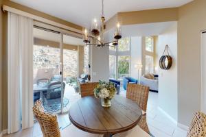 a dining room with a wooden table and chairs at Briarwood Terrace in Phoenix