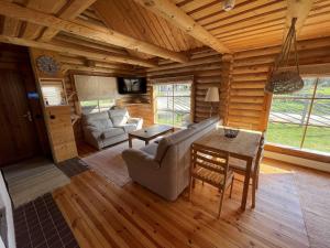 a living room with a couch and a table at Nuustakumajad in Otepää