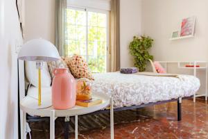 A bed or beds in a room at Casa la Fontana - Hostatel