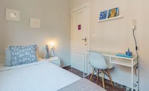 A bed or beds in a room at Casa la Fontana - Hostatel