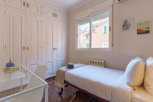 A bed or beds in a room at Casa la Fontana - Hostatel