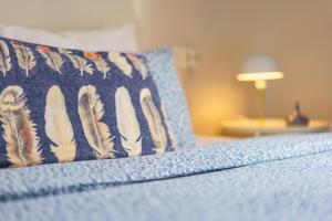 A bed or beds in a room at Casa la Fontana - Hostatel